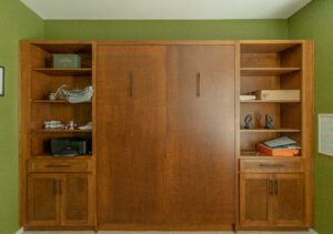Vertical queen Murphy bed with stained cabinets