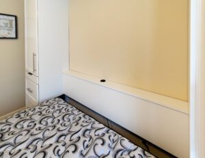 Murphy bed headboard with powered grommet for charging cell phones
