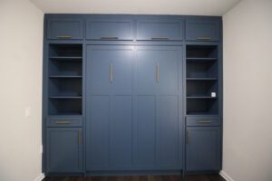Vertical queen Craftsman Murphy bed with custom cabinetry, painted Dark Secret