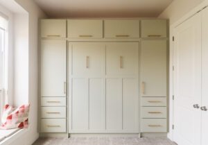Vertical queen Craftsman Murphy bed with custom cabinetry, painted October Mist