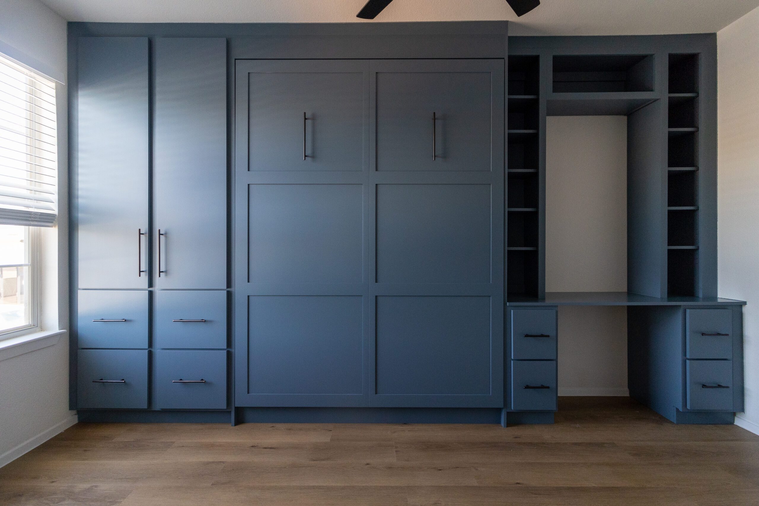 Vertical queen Shaker Murphy bed with integrated desk and full cabinetry, painted slate blue, Austin TX