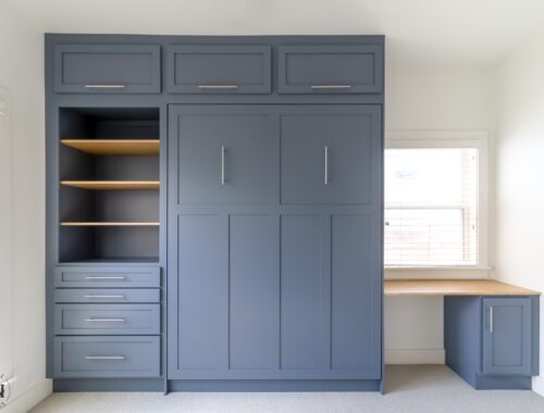 Blue Craftsman Murphy Bed with Built-In Desk | Madewell Woodworks Austin - Madewell Woodworks Blue Craftsman Murphy bed with built-in desk, shelving, and modern hardware, handcrafted by Madewell Woodworks in Austin, Texas.