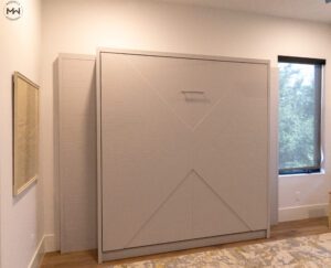 King-size Enfield Murphy bed featuring signature chevron paneling and a soft neutral finish, handcrafted by Madewell Woodworks in Austin, Texas.