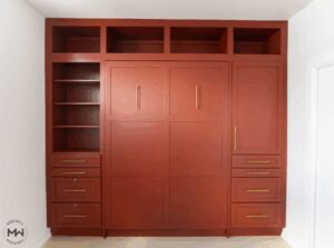 Red Shaker Murphy bed with built-in drawers and shelving, handcrafted by Madewell Woodworks in Austin, Texas.