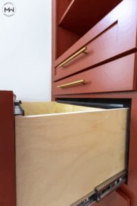 Close-up of red Shaker Murphy bed file drawer with full-extension soft-close rails, handcrafted by Madewell Woodworks in Austin, Texas.