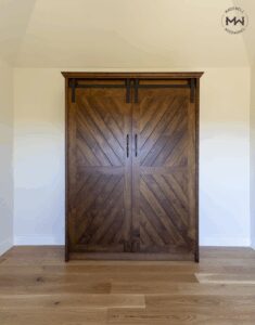 Chevron Barn Door Murphy Bed in Maple – Madewell Woodworks - Madewell Woodworks Custom chevron-style Murphy bed with sliding barn doors in rich walnut finish, handcrafted in Austin, Texas by Madewell Woodworks.