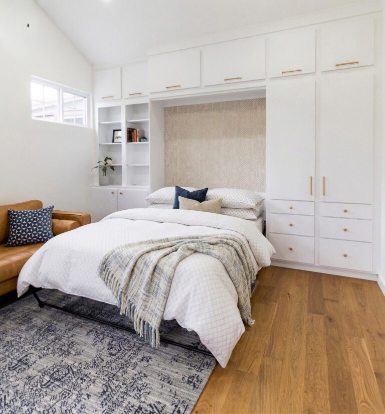 Queen Murphy bed in a casita guest space, fully open with bedding and pillows visible